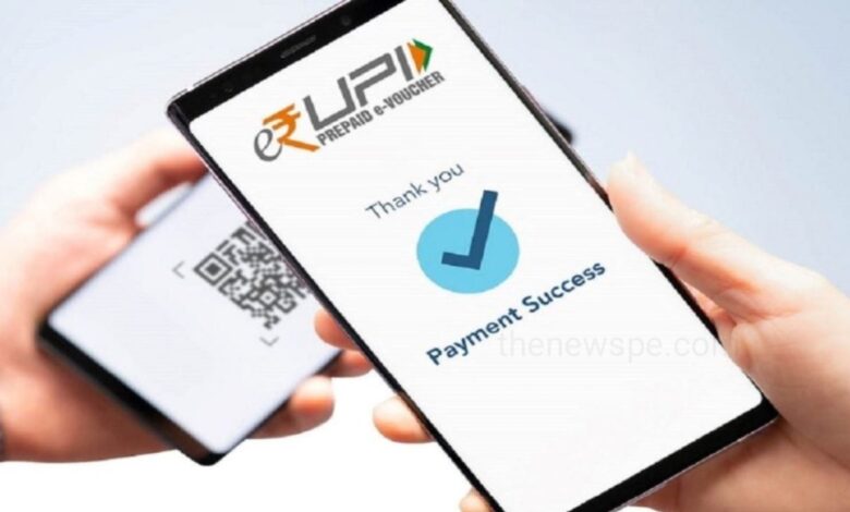 A Person Holding Phone Showing UPI Scan with New UPI Rules